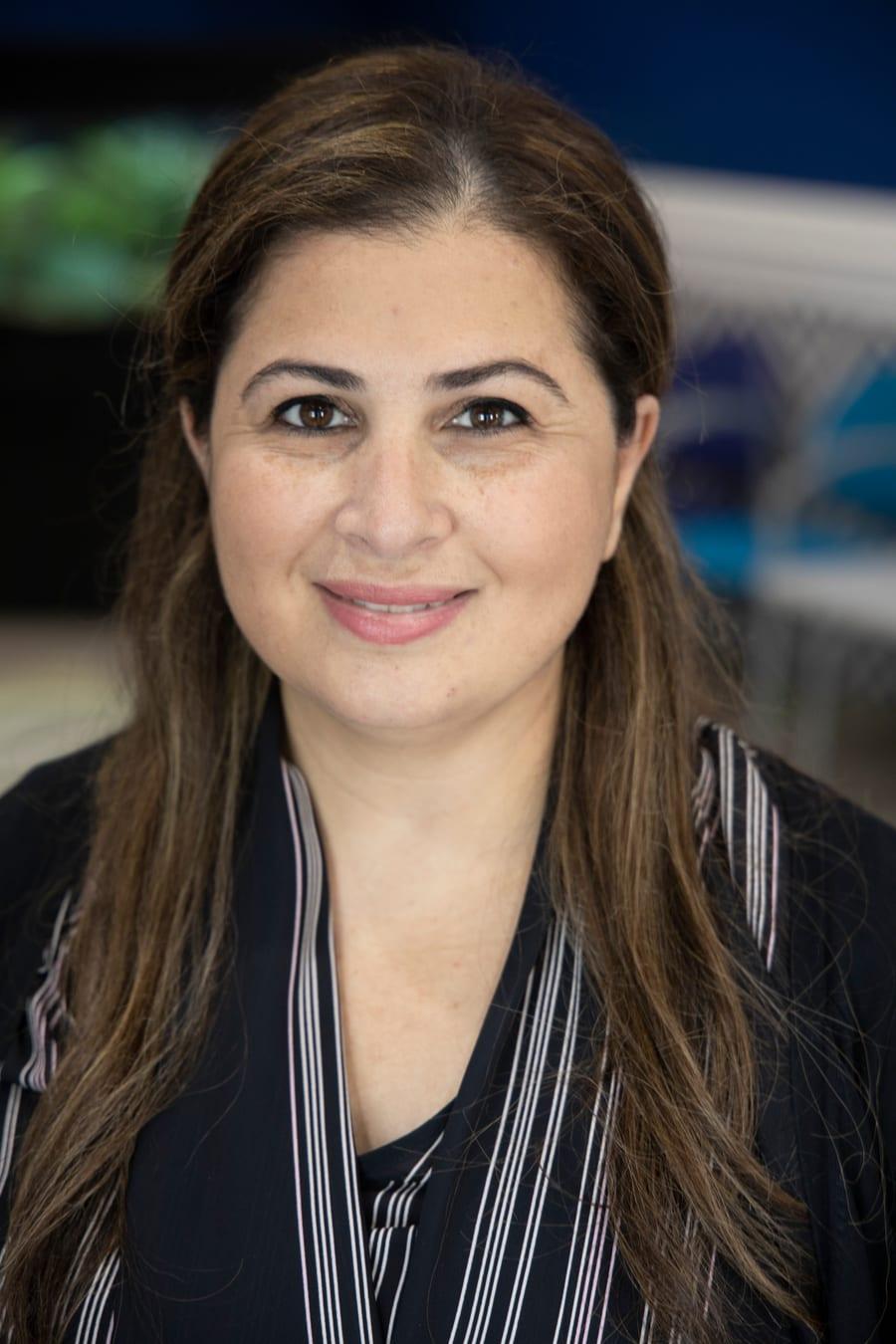 Dr. Sahar Alrayyes, board-certified pediatric dentist at Kids Dentist in Grayslake, Illinois