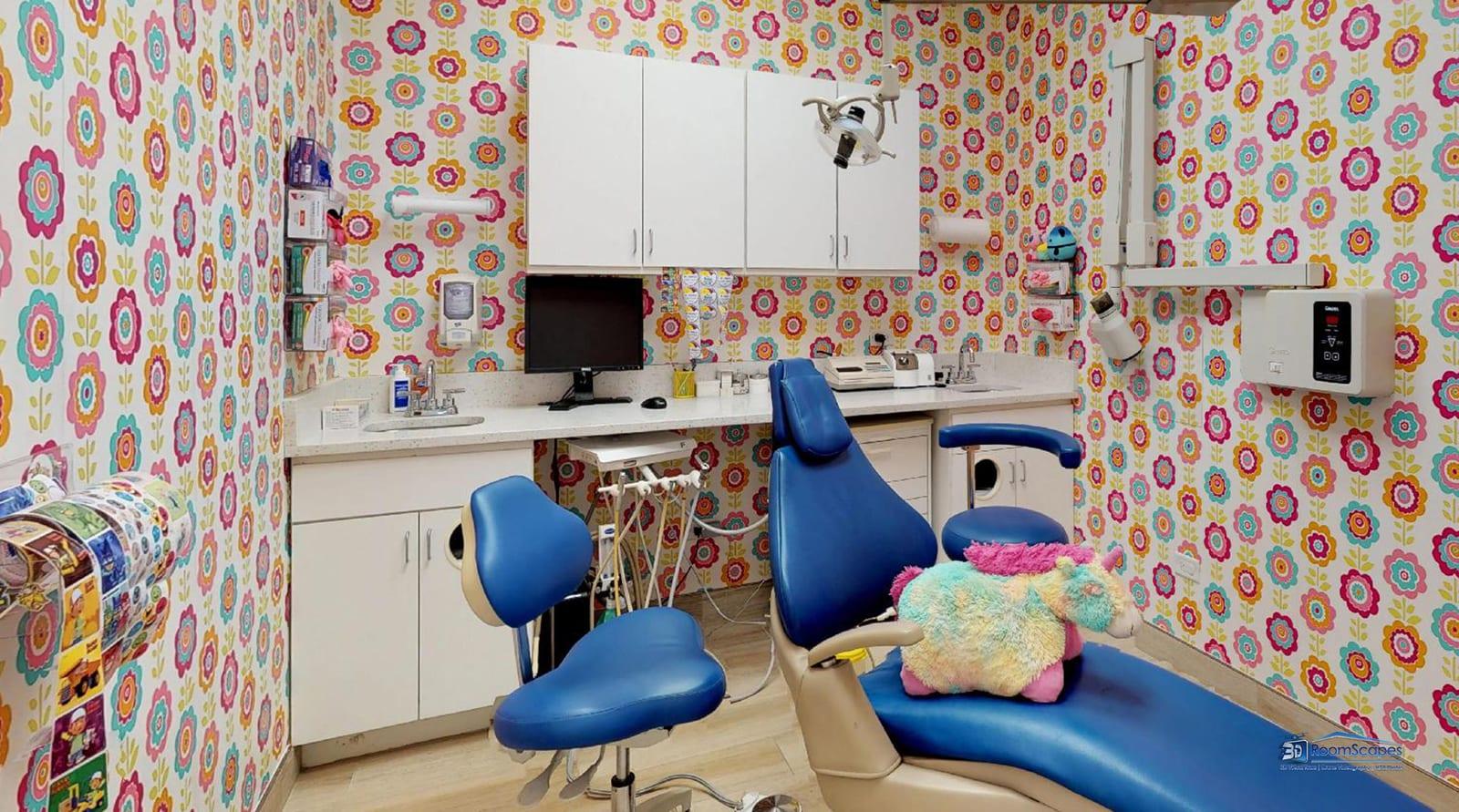 Soothing treatment bay at Kids Dentist Grayslake with overhead TV and child-centered equipment