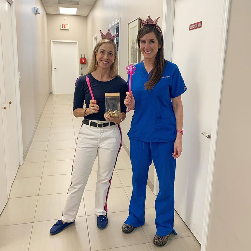 Two dental team members dressed up for National Tooth Fairy Day