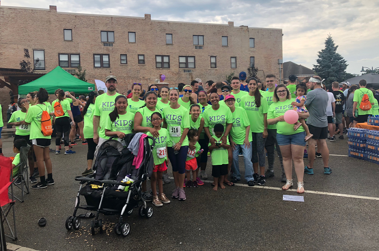 Large group of dental team members and community at five K event