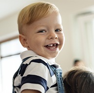 Toddler with a knocked out baby tooth