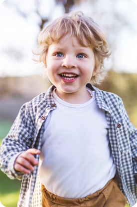 Toddler smiling after dental sealant and fluoride treatment