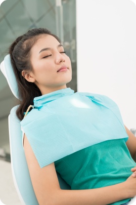 Teen girl relaxing under nitrous oxide dental sedation