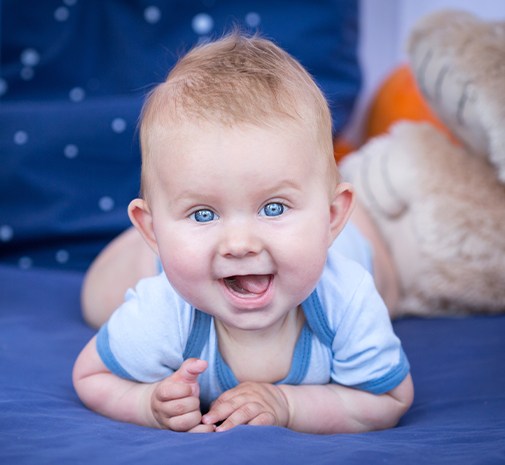 Baby laughing after oral health risk assessment visit
