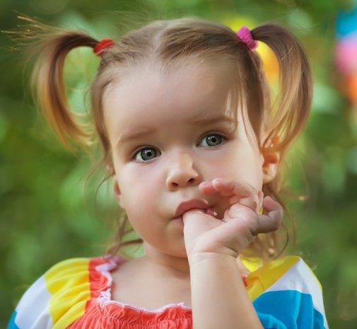 Child sucking her thumb