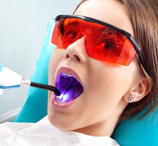 Young patient receiving dental bonding