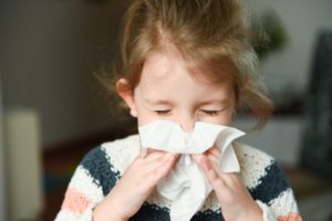kid during cold and flu season keeping their smile healthy