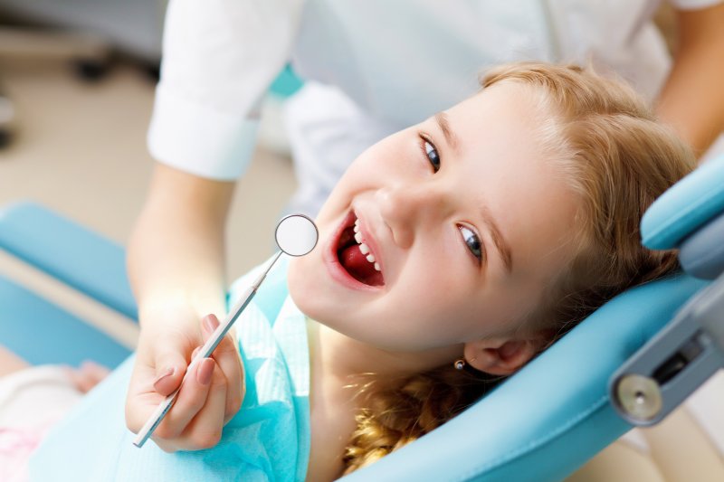 a child in the dentist’s chair